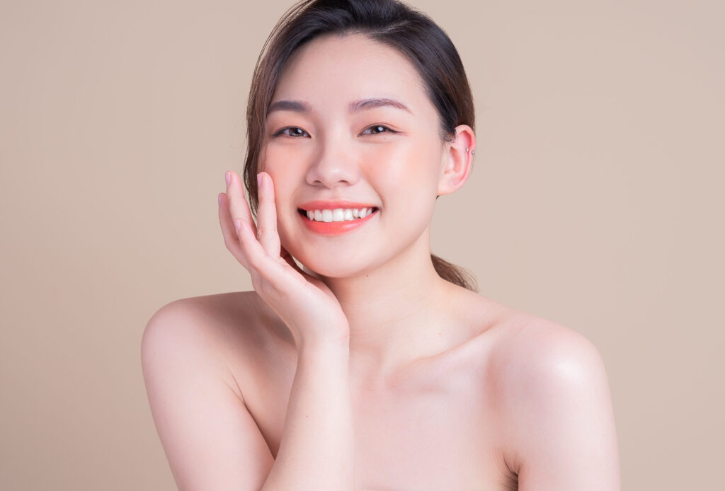 Attractive young Asian woman with fresh skin. Face care, facial treatment, , woman beauty skin isolated on white background. cosmetology, beauty skin and cosmetic concept